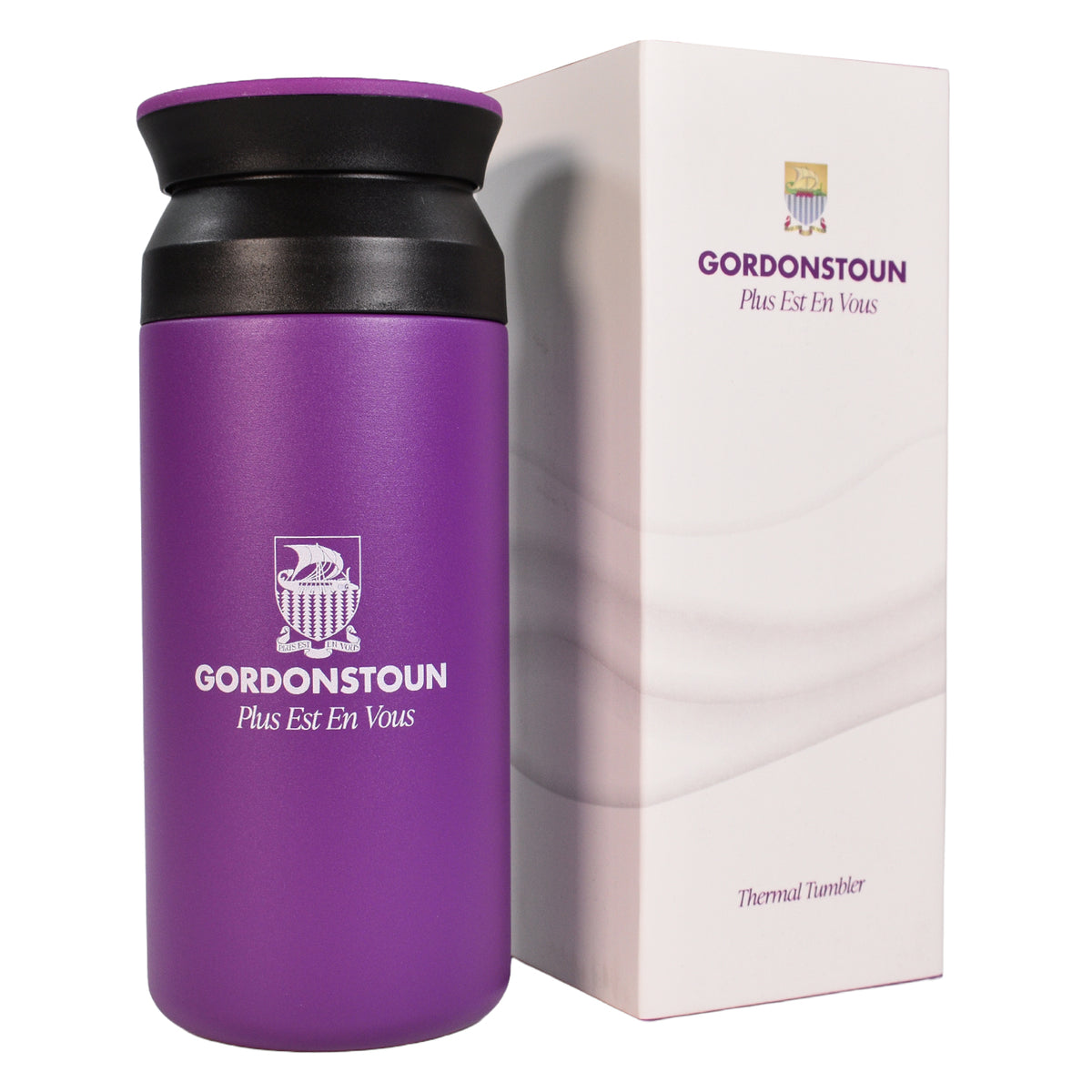 A purple insulated thermal tumbler with a black lid next to its white branded packaging box, featuring the GORDONSTOUN logo and 'Plus Est En Vous' text.