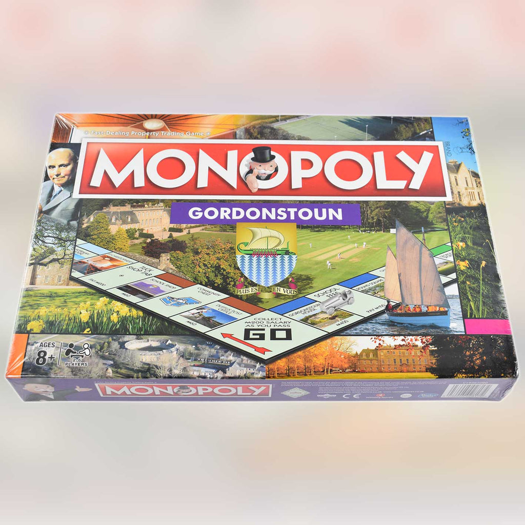 Monopoly board game box with 'Gordonstoun' edition on a blured background